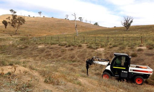 Digging holes in the Lucerne paddock gully